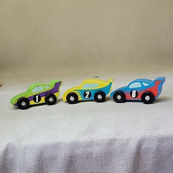 Assorted small wood vehicles..train, dumo truck, race cars... - Picture 7 of 8